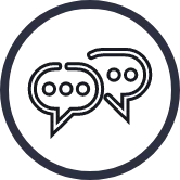 A black outline of a circle that contains a white outline of two speech bubbles that are next to each other.